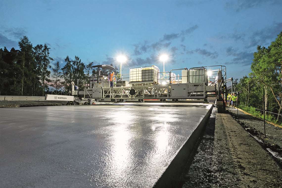 Two slipform pavers and a texture curing machine from Wirtgen