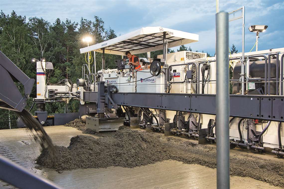 Two slipform pavers and a texture curing machine from Wirtgen