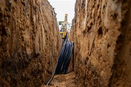 HDPE pipes in an unsupported trench ahead of installation 