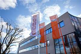 Boels and Cramo flags outside of a Cramo facility