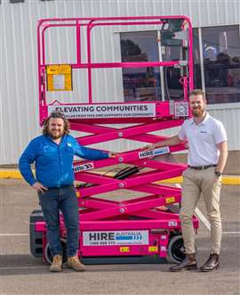 Keith Clarke and Matt Reeves with Hire Australia's new vibrant pink scissor lift.