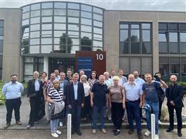 Members of the Ukranian delegation and Tsurumi outside the company's European headquarters.