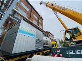 Steam boiler rented by Tibbloc being craned into place at a manufacturing facility in France.