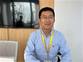Photo of Ares Song, head of the export department at LGMG’s aerial platform international marketing division, pictured at Bauma China. (Photo: Access International)