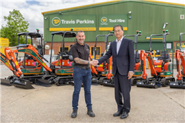 Photo showing Adam Caulfield (Managing Director of Travis Perkins Hire) and Yasukazu Kamada (President & CEO of Kubota Holdings Europe) following the supply agreement between the two companies.