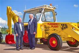 JCB Chairman Anthony Bamford and Pat Flannery Snr pictured by Flannery Plant Hire’s original 1972 JCB 3C backhoe loader. (Photo: JCB)