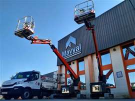 A branch of equipment rental company Mavyal in Spain, with two access platforms erected outside a building displaying its logo