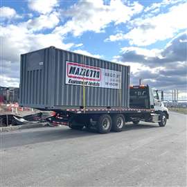 Photo of a storage container being transported by Mazzotta Rentals. (Image: Mazzotta Rentals)