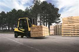 Photo of Hyster’s H3.0A forklift moving timber supplies in a yard. (Image: Hyster)