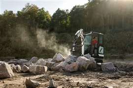 Bobcat E16 mini excavator breaking rocks