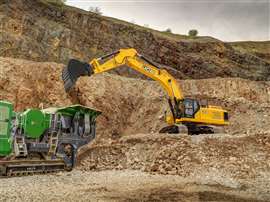 Une pelle mécanique JCB jaune au travail dans une carrière
