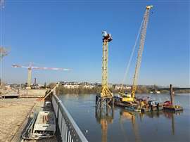 UPotain cranes from Uperio on the water