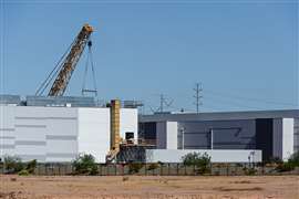 Large data center facility under construction with a lattice boom crane and structural work in progres (Image: Eduardo Barraza via AdobeStock - stock.adobe.com)