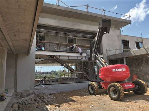 One of LCM’s Manitou boom lifts on a construction project