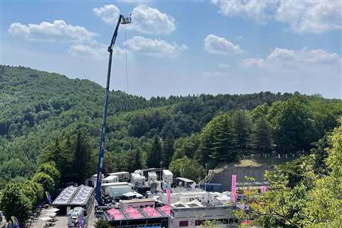 The 65-m-high truck towers over one of the event's Open Villages.