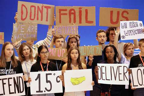 Climate activists take part in a protest at the COP27 summit in Egypt