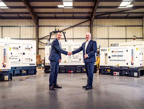 Star Power head of power Paul Ridley (left) and Watling JCB sales director Chris Armitage mark the handover of the first generators at Watling JCB's headquarters in Peterborough, Cambridgeshire.