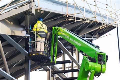 Using-the-Niftylift-HR21-articulated-boom-lift,-workers-were-able-to-reach-up-and-under-the-roof-to-complete-essential-work-with-ease