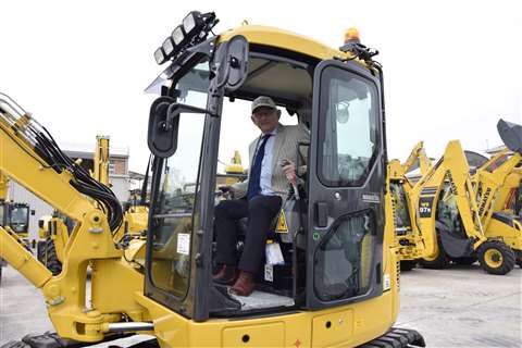 Tim Jones Ridgway Rentals CEO inside a new Komatsu excavator