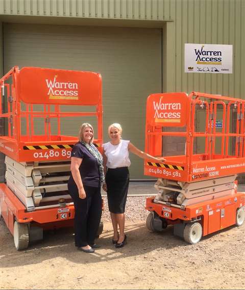 Snorkel UK's Linda Betts hands over the lifts at the new Warren Access Huntingdon branch to Nikki Hill, Operations Manager