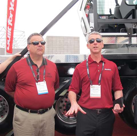 Fred Ross, left, president and owner of Custom Truck &amp; Equipment, stands with Jim Glazer, right,