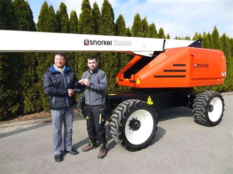Snorkel's Roman Heindl hands over the first Snorkel T46JRT in Germany to Hubert Müller.