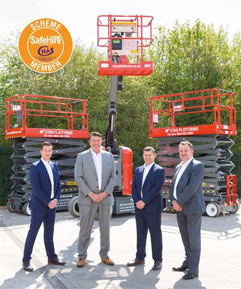 The Star Platforms team of directors standing in front of scissor lifts and a vertical boom.