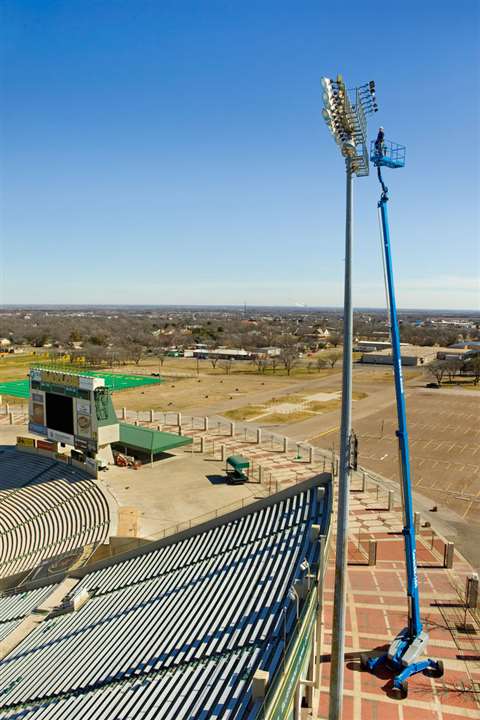 A Genie SX-180 super boom carrying out stadium lighting work.